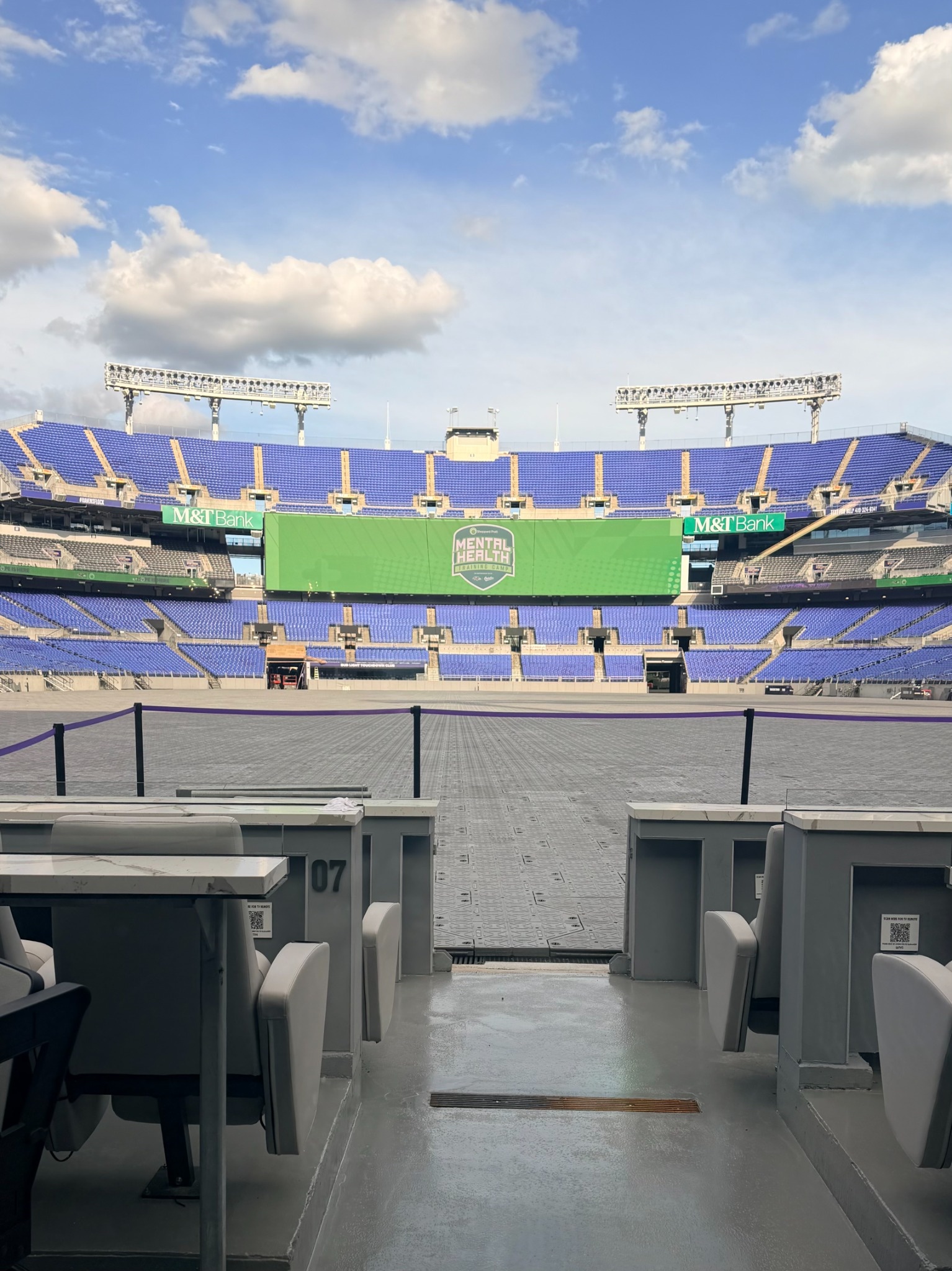 Wide view of M&T Bank Stadium with Mental Health Training Camp branding on the video board